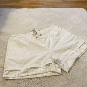 White Adidas active shorts.